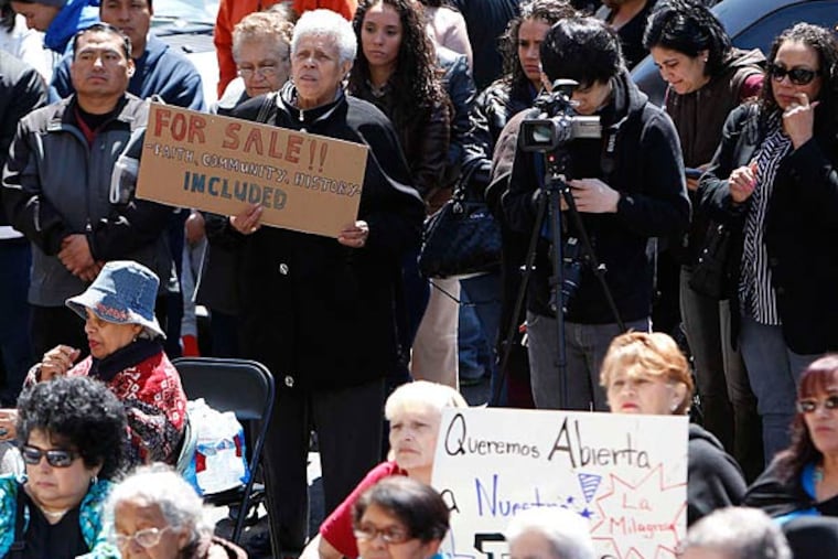 More than 100 people rallied Sunday in an attempt to keep La Milagrosa church in Spring Garden open. (David Maialetti/Staff)