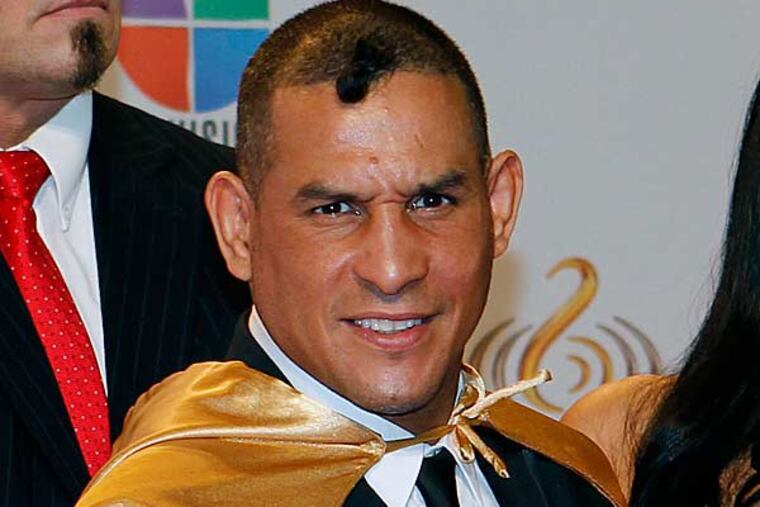 Former boxer Hector Macho Camacho, foreground center, poses for photographers at his arrival at the Premio Lo Nuestro Music Awards in Miami, Thursday, Feb. 16, 2012. (Alan Diaz/AP)