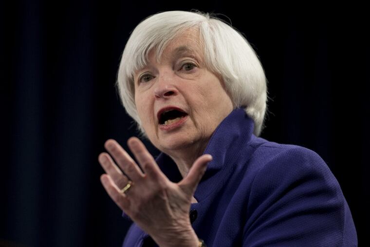 Federal Reserve Chair Janet Yellen speaks during a news conference following the Federal Open Market Committee meeting in Washington. The Fed said Wednesday that it's lifting its short-term rate by a modest quarter-point to a still-low range of 1.25 percent to 1.5 percent. It is also continuing to slowly shrink its bond portfolio. Together, the two steps could lead over time to higher loan rates for consumers and businesses and slightly better returns for savers.