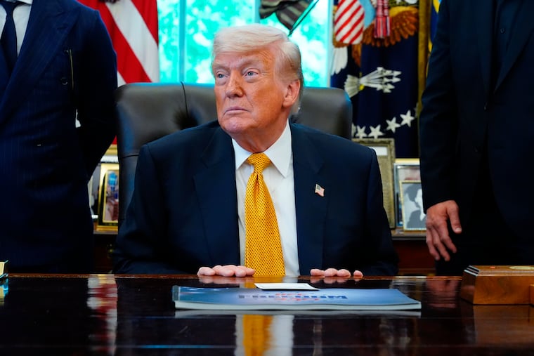 President Donald Trump meets with UFC fighters Wednesday in the Oval Office of the White House.