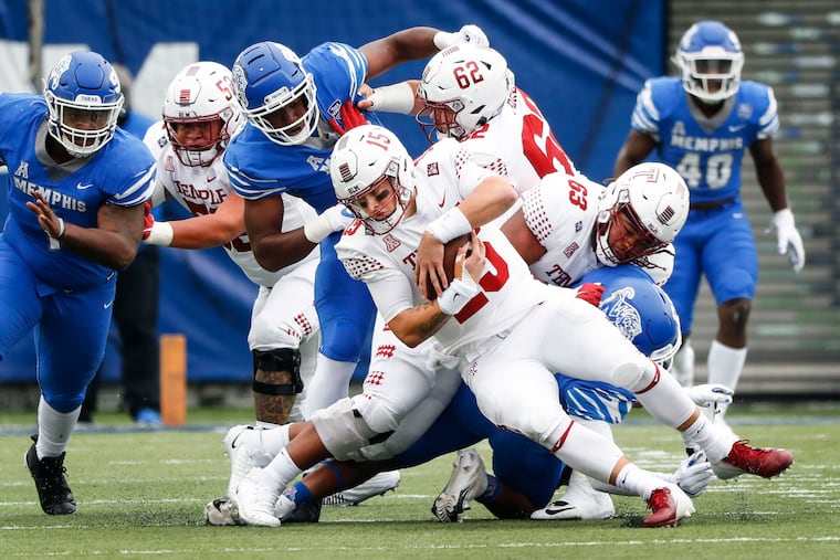 Temple quarterback Anthony Russo is sacked by the Memphis defense.