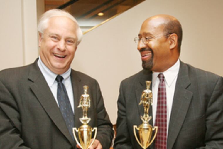 Friendly rivals Al Taubenberger (left) and Michael Nutter with trophies to be presented to the winners of the annual "Sandwich Make-off" contest at the Bellevue Food Court. The mayoral hopefuls also served on the judging panel.