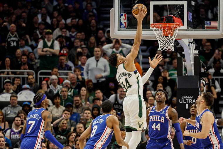 Milwaukee Bucks forward Giannis Antetokounmpo (34) shoots against the Philadelphia 76ers during the first half of an NBA basketball game on Sunday in Milwaukee.