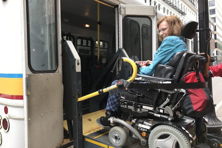 Elizabeth Dean-Clower boards a paratransit vehicle in Boston. A physician and disability advocate, she has been following the MBTA’s experiment with using ride-hail vehicles to make it easier for people with disabilities to get around.