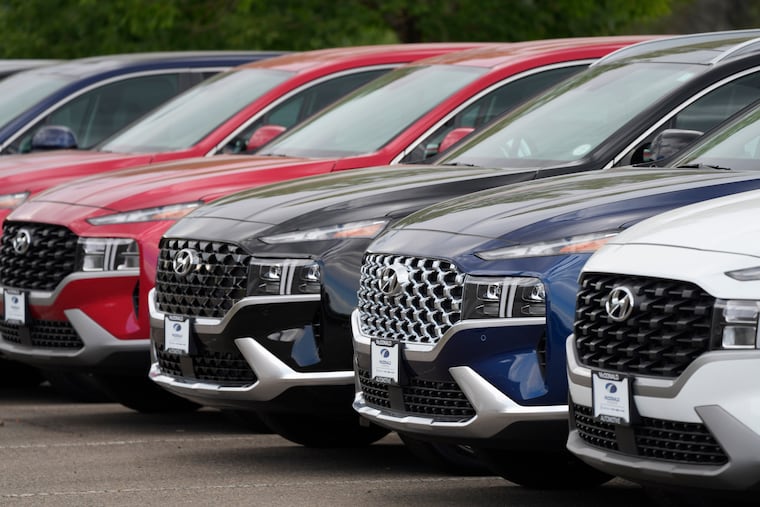 A line of 2022 Santa Fe SUVs sit outside a Hyundai dealership in Littleton, Colo.