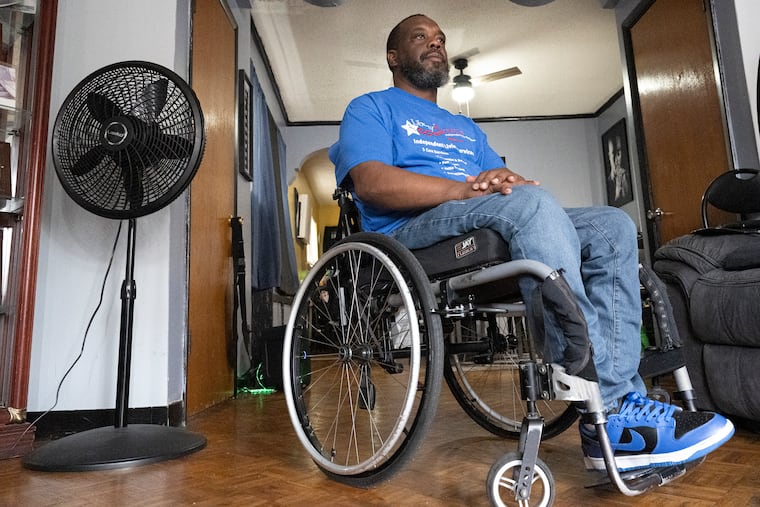 Rodney Whitmore at his home in Philadelphia, Pa. He uses a wheelchair and has found great relief in his employer's hybrid work schedule. A new study shows that remote and hybrid work sent employment among people with physical disabilities soaring.