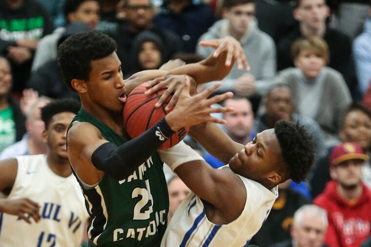 Camden Catholic's Zach Hicks (left) and Paul VI's Tyshon Judge battle for a loose ball last season.
