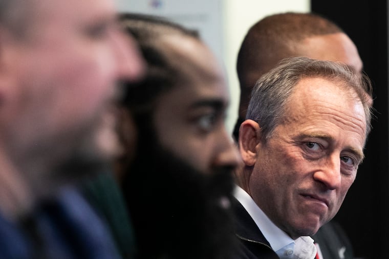 Sixers owner Josh Harris lookw on during a press conference introducing both James Harden (left) and Paul Millsap (not pictured) at the Philadelphia 76ers Training Complex in Camden, NJ on Tuesday, Feb. 15, 2022.