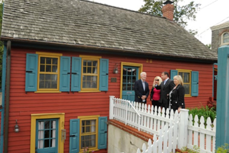 From left Asko Vuorinen, Lisa Rysinger of the Mullica Hill Historical Society; Lou Manzo, Mullica Hill Mayor; and his Sinikka Vuorinen stand at the front door of the house known as Mullica House, built by Eric Mullica and his wife, Ann Catherine, in 1704. (Ron Tarver / Staff Photographer)