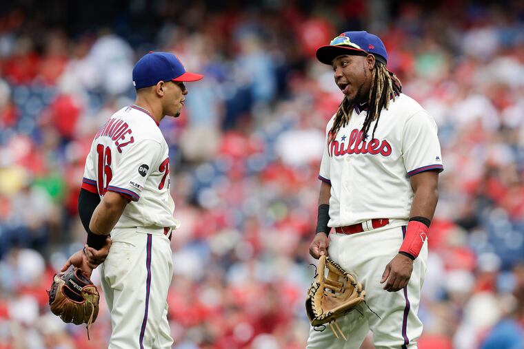 Third baseman Maikel Franco and second baseman Cesar Hernandez chat during their final game as Phillies Sept. 29 at Citizens Bank Park.
