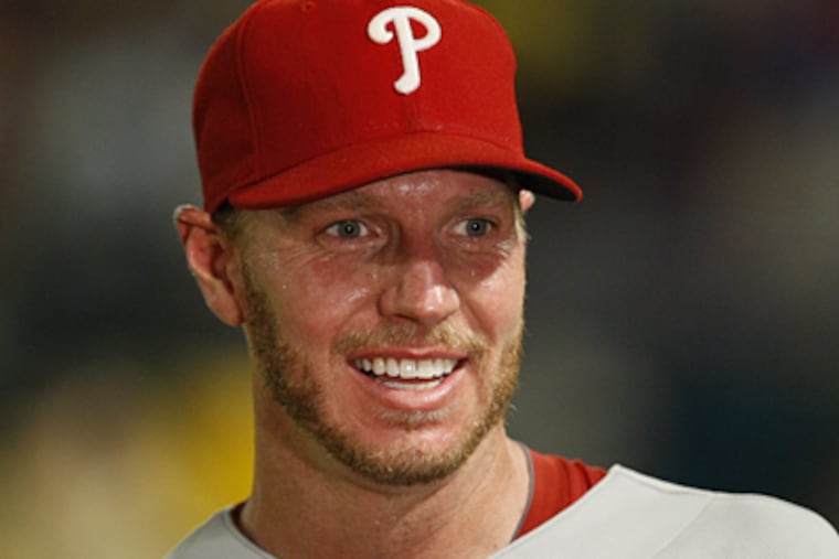 Roy Halladay smiles after throwing a perfect game in the Phillies' 1-0 win over the Marlins on Saturday. (AP Photo/Wilfredo Lee)