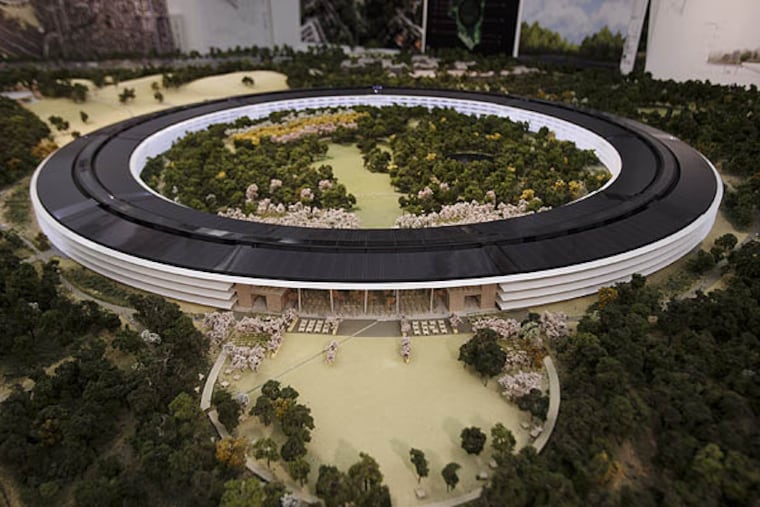 An overview of a rendering of Apple's proposed new campus is displayed at the proposed new campus site, October 10, 2013 in Cupertino, California. The plan will go up for a final vote before the Cupertino City Council on Oct. 15. (Dai Sugano/Bay Area News Group/MCT)