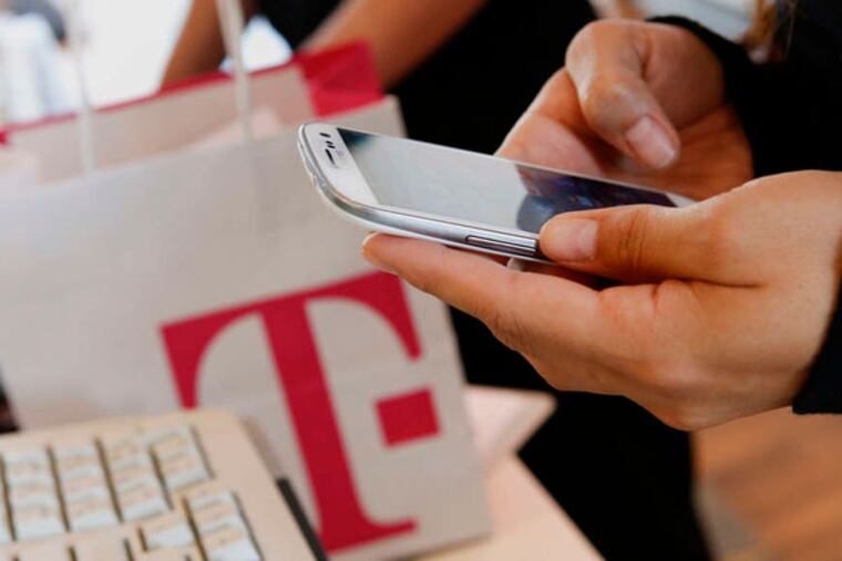 T-Mobile says its the first carrier to launch caller verification technology to combat scam calls . (Patrick T. Fallon / Bloomberg)