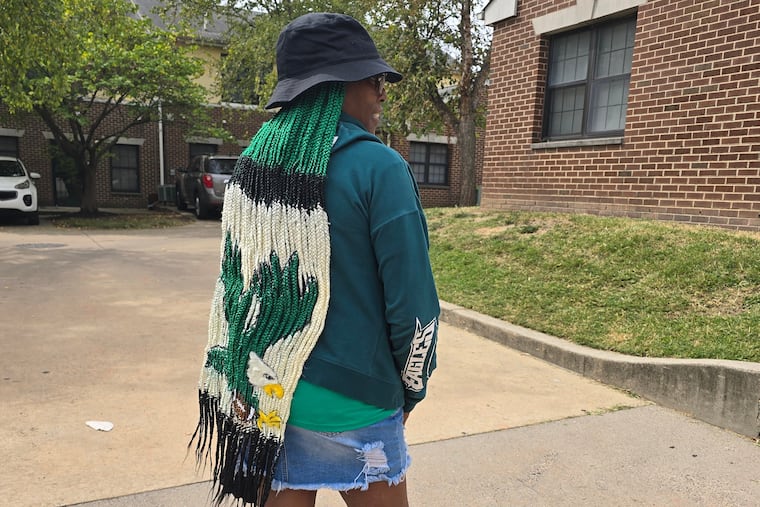 Eagles superfan Tina McIntosh purchased a team-themed wig just in time for game day.