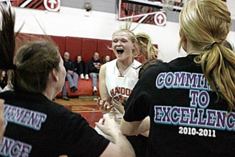 Haddon Township's Katie Getzinger celebrates after winning the S.J.Group 1 final, 47-46 in overtime. (Elizabeth Robertson / Staff Photographer)