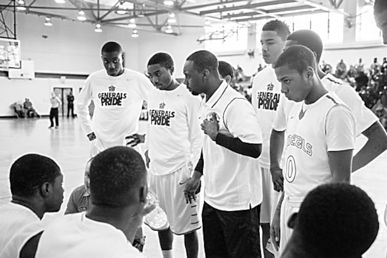 Constitution Generals Head Coach Robert Moore addresses the team during a timeout. Saturday February 14th, 2015. (Chris Fascnelli/Staff Photographer)