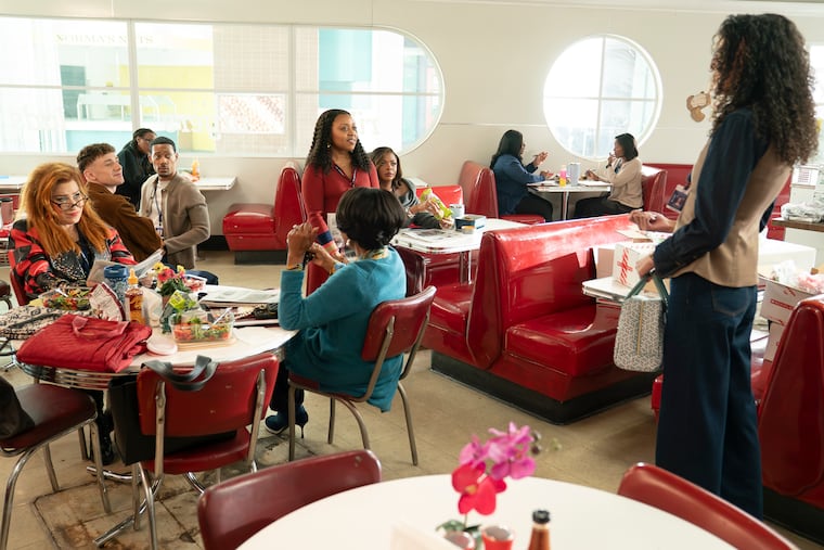 In this week's episode of 'Abbott Elementary,' titled “Mall Part 3: Heroes," the teachers land on the front page of the Philadelphia Inquirer. Showrunner and star Quinta Brunson (center), who grew up in West Philly, holds a copy of the newspaper.