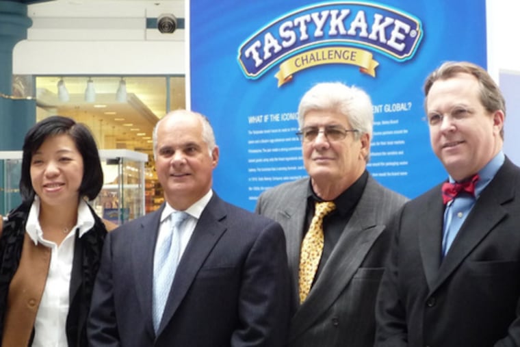 At a meeting on Tastykake's future are (from left) Jennifer Tsai, Tastykake CEO Charles Pizzi, Ricardo Rousselot and Christopher Bailey.