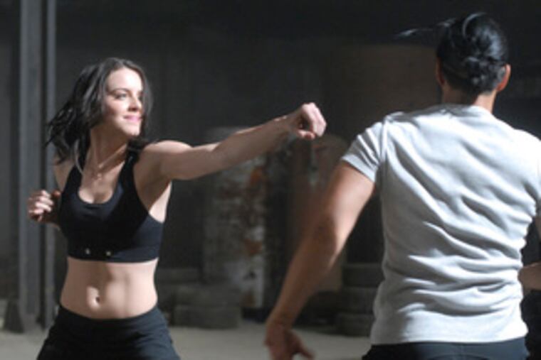 Michelle Ryan , the Brit who stars as the "Bionic Woman," uses her high-tech muscle power against Will Yun Lee.
