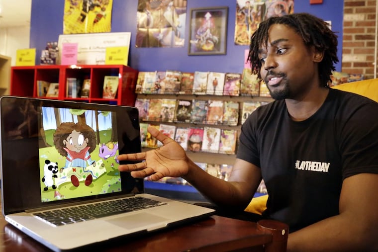 Chris Coleman talks about one of his children’s book characters while at Amalgam Comics and Coffeehouse.