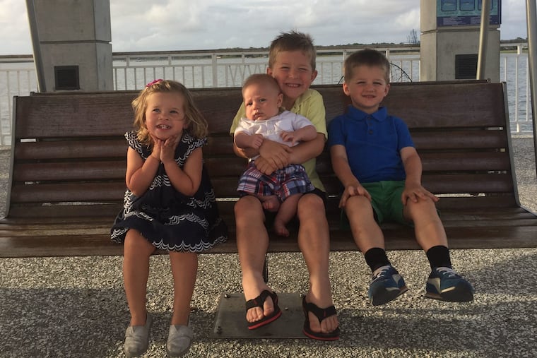 The Zane children: Mila, Boden (holding Fletcher) and Jack.