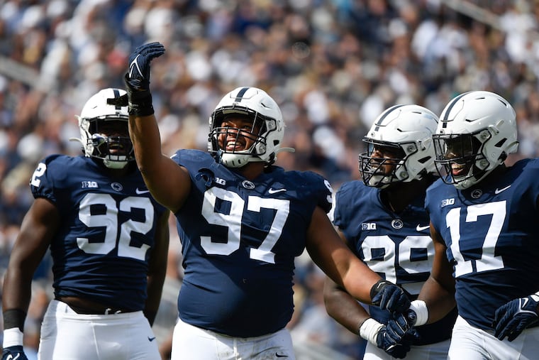 Penn State defensive tackle PJ Mustipher (97) celebrates after sacking Villanova quarterback Daniel Smith on Sept. 25.