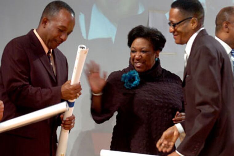 Philadelphia School Superintendent Arlene Ackerman congratulates principals Johnny Whaley (left), of the High School for Creative and Performing Arts, and Roy McKinney, Jr., from Barratt middle school. (Clem Murray / Inquirer)