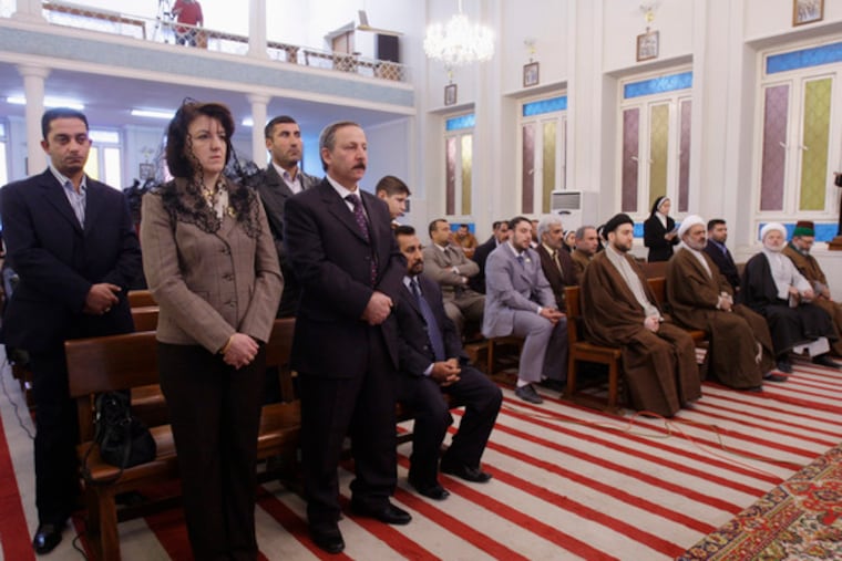 and Iraqi officials attend Christmas Mass at Mary's Daughters Monastery in Baghdad. Iraq declared Christmas a national holiday.