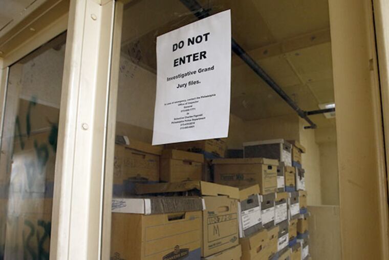 A small room with bulletproof glass and pieces of paper taped to it that reads "DO NOT ENTER / INVESTIGATIVE GRAND JURY FILES," on the seventh floor in City Hall on Monday, July 28, 2014. ( YONG KIM / Staff Photographer )