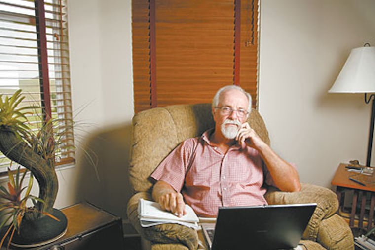 Wayne Robert Williams, 61, sits at his workstation in his Lake Jovita home on Sept. 1, 2009. (Photo: St. Petersburg Times)