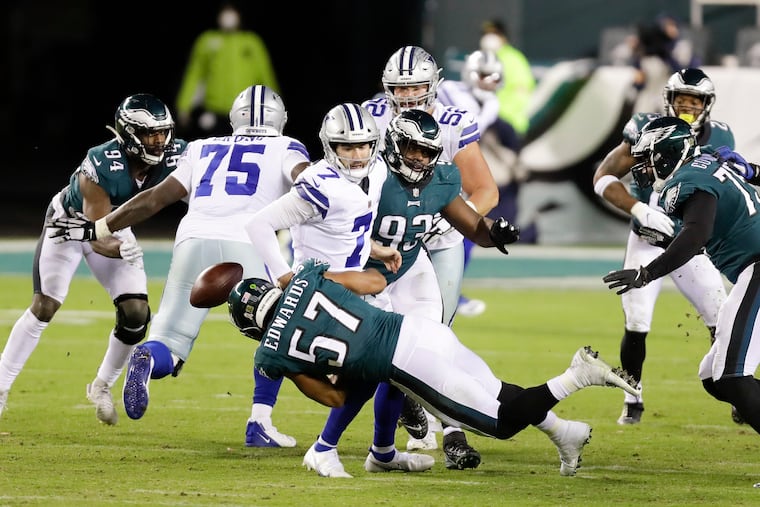 Eagles linebacker T.J. Edwards (57) comes on a blitz and forces a critical fumble late in Sunday night's win over the Cowboys.