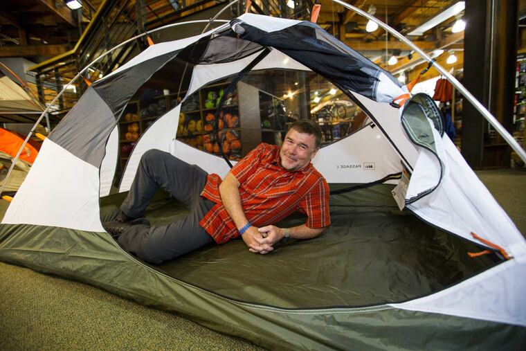 REI's chief executive, Jerry Stritzke, stretches out in a tent at the flagship store in Seattle. (Mike Siegel/Seattle Times/TNS)