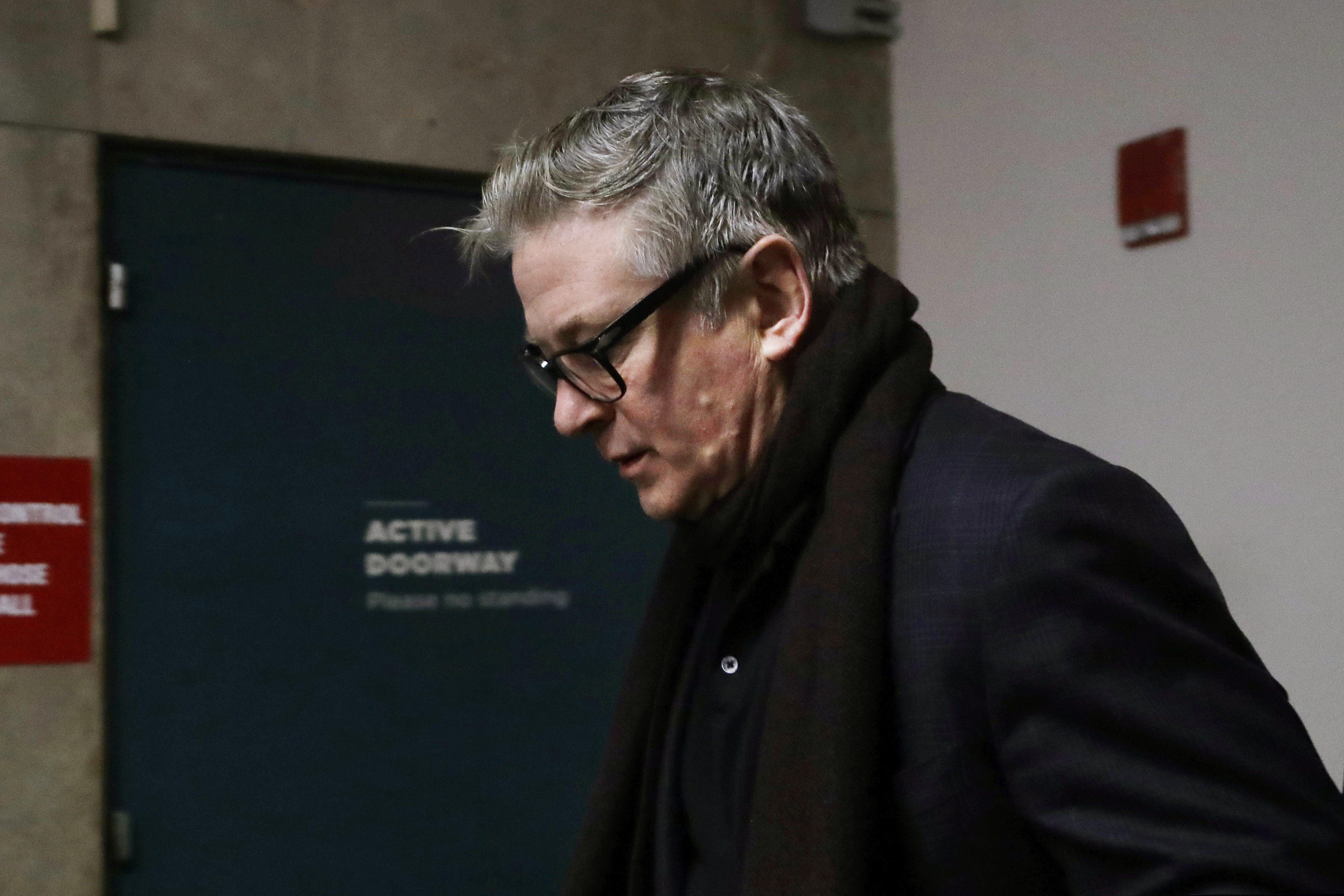Actor Alec Baldwin arrives in a New York City court, Wednesday, Jan. 23, 2019, for a hearing on charges that he slugged a man during a dispute over a parking spot last fall.