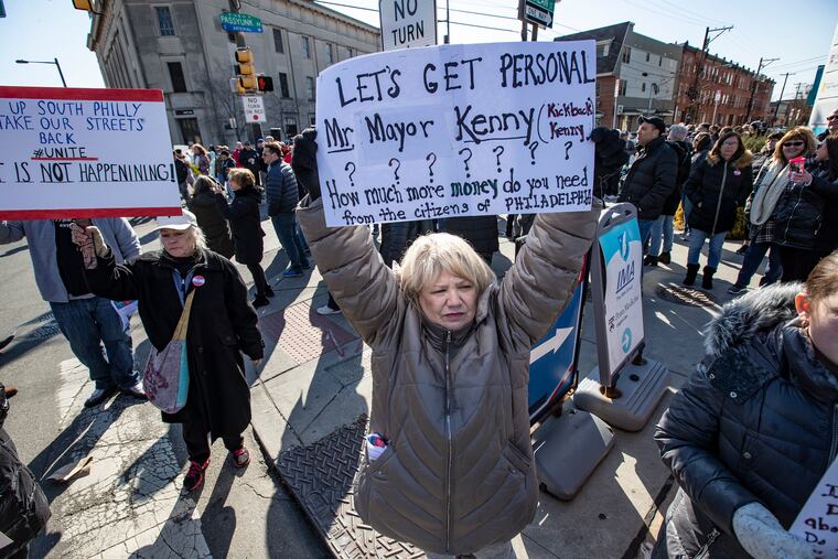 Carlyn Novelli, center, a resident of South Philadelphia, holds up her sign of protest at the corner of South Broad Street and Passyunk Avenue, as she and many others gathered to protest on March 1, 2020, their oppostion to the proposed safe injection site at the Constitution Health Plaza, on 1930 S. Broad St. .