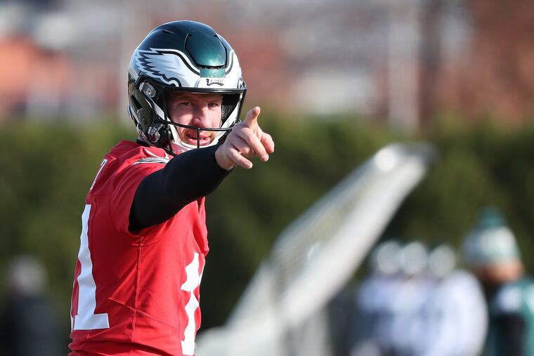 Eagles quarterback Carson Wentz points to a receiver during to the Philadelphia Eagles practice at the NovaCare Complex on Thursday. A big game by Wentz Sunday would go a long way in helping the Eagles beat the 8-1 Patriots.