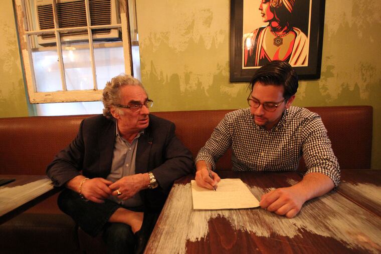 Crow & the Pitcher owner Michael Franco goes over Georges Perrier's menu suggestions in the dining room of the restaurant.