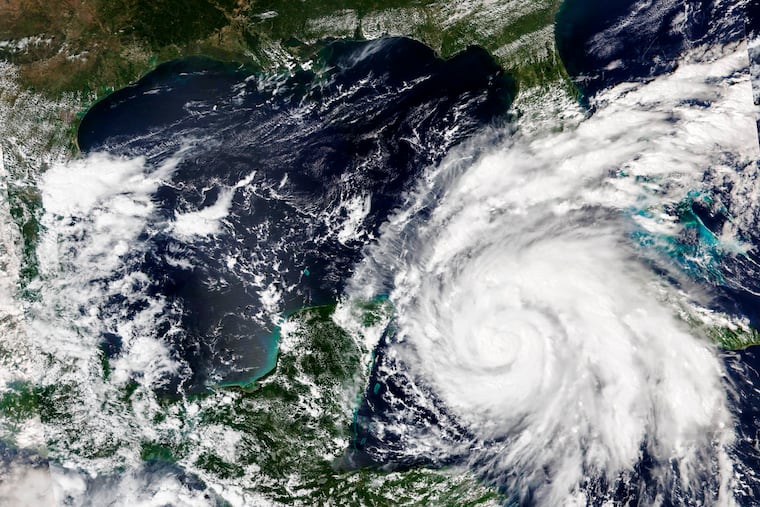This Sept. 26, 2022, satellite image released by NASA shows Hurricane Ian growing stronger as it barreled toward Cuba.