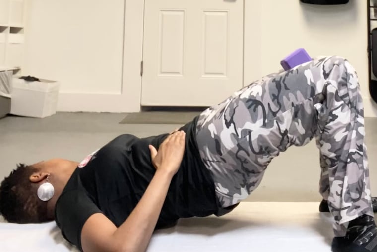 Demonstrating pelvic floor exercises.