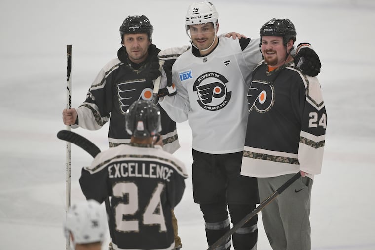Garnet Hathaway (center) interacts with service members with USO during a Military Appreciation Day at their Voorhees practice center.