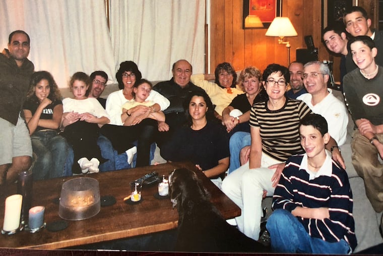 Mr. Erlichman (center) always had a smile for his family.