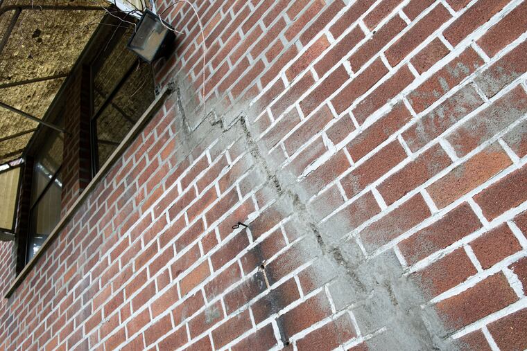 A Southwest Philadelphia homeowner had to fix this large crack in the fixer-upper she bought in 2022. A new Zillow report found that, nationally, a home labeled a “fixer-upper” sells for 7% less than a similar home — the largest discount in three years.