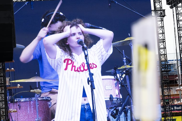 Annabelle Dinda performs an opening set during the Philadelphia stop of Noah Kahan's "The Great Divide Tour" at Citizens Bank Park on June 26, 2026. Dinda was one of two opening acts performing before Kahan took the stage.