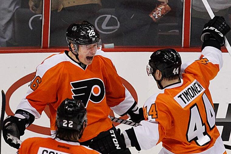 Ruslan Fedotenko celebrates his game-winning goal with his teammates. (Ron Cortes/Staff Photographer)