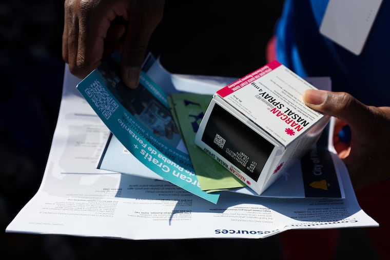 A kit including Narcan nasal spray and other resources is held by members of the Philadelphia Office of Community Empowerment and Opportunity before they go out canvassing in North Philadelphia on Thursday, Oct. 19, 2023. Health officials in Philadelphia credit canvassing efforts and other outreach work with a drop in fatal overdoses in 2024.