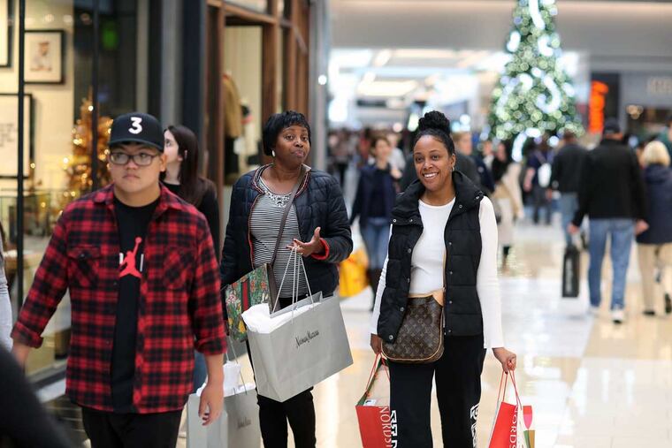 Karen Apollon, 48, of Fort Lee, N.J., and Delores Robinson, 45, of Woolwich, N.J., shop at the King of Prussia Mall on Black Friday.