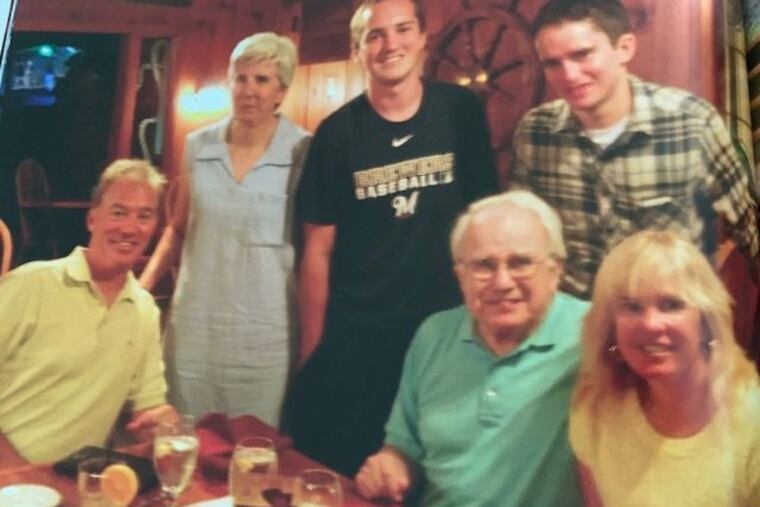 Mr. Miller (front, second from right) is joined by, left to right, son-in-law Steve Derrick, daughter Kate, grandsons Sean and Blake Derrick, and daughter Meg. He was a respected lawyer and judge.