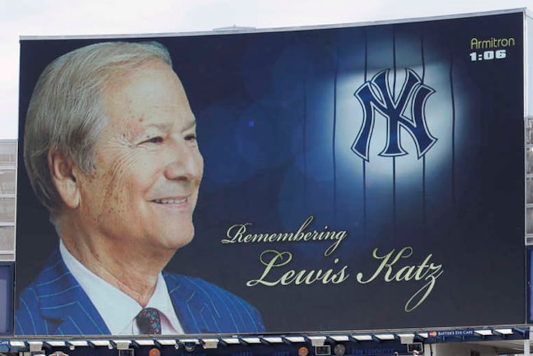 ASSOCIATED PRESS / COURTESY NEW YORK YANKEES Yankees players and fans observe a moment of silence yesterday in memory of Lewis Katz, who was a minority owner of the team.