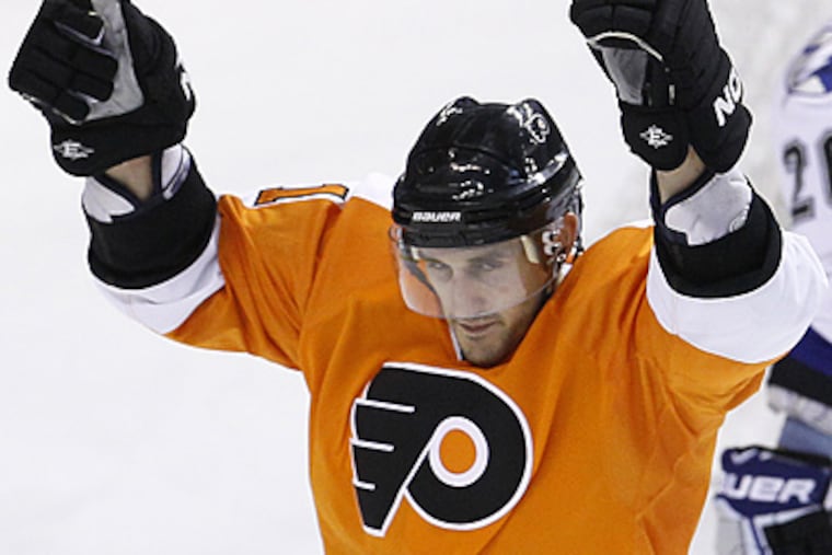 Philadelphia Flyers' Blair Betts, left, reacts after scoring a goal. (AP Photo/Matt Slocum)