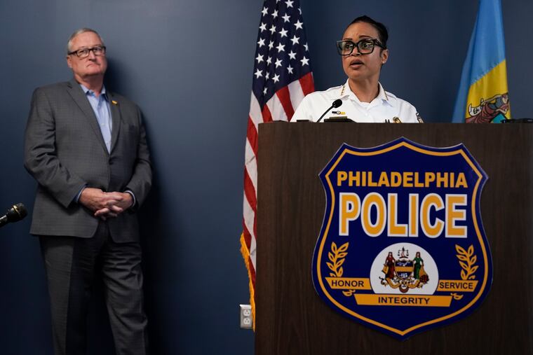 Philadelphia Police Commissioner Danielle Outlaw, right, accompanied by Mayor Jim Kenney. Outlaw announced her resignation Tuesday. Her last day will be Sept. 22.