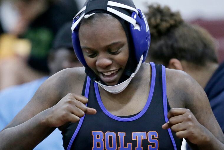 Millville senior Diana Johnson reacts after winning the 161-pound title at the South Region girls' wrestling tournament Feb. 17 at Red Bank Regional High School.